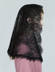 Black lace veil detail showing intricate floral pattern and elegant side profile look.