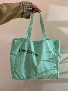 Light green canvas tote bag, large capacity casual shoulder bag for daily use and travel.