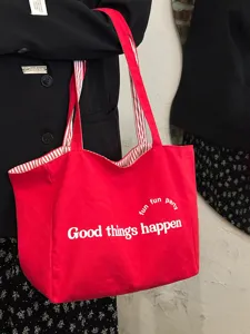 Koreanische rote Canvas-Tasche, große Kapazität, Buchstaben-Druck, Schultertasche für Pendler.