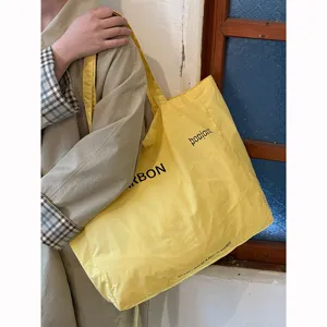 Casual yellow canvas tote bag, large capacity stylish shoulder bag for daily casual use.