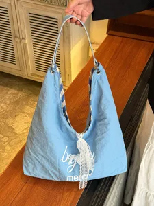 Casual canvas shoulder bag with lace bow and striped straps for women daily commute style.