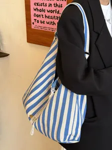 Korean style casual blue and white striped canvas shoulder bag detail view for commute.