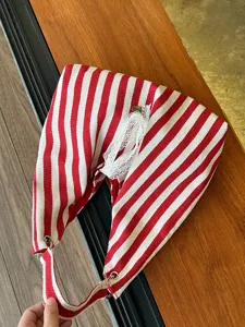 Red and white striped canvas tote bag with lace trim, casual underarm shoulder bag.