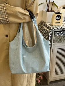 Casual denim tote bag detail view, showing soft fabric, large capacity and stylish design.