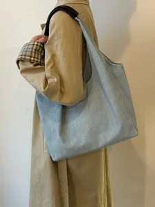 Casual denim tote bag for women, large capacity shoulder bag for daily commute and school.