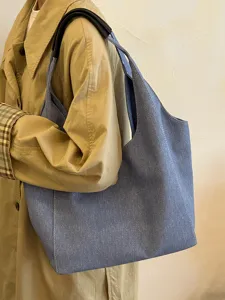 Casual blue denim tote bag for women, large capacity shoulder bag for daily commute.