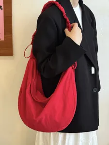 Red Korean style gathered drawstring cloud bag detail view showing soft large capacity fabric design.