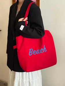 Koreanische rote Canvas-Tasche mit blauer Beach-Stickerei für lässige Studenten im Alltag.