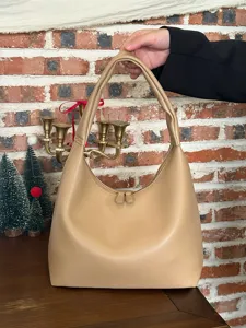 Minimalist soft leather underarm bag for women, chic casual shoulder handbag for daily wear.