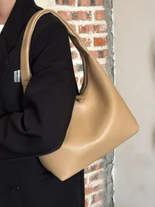 Minimalist soft leather shoulder bag for women, casual hobo tote, stylish daily purse.