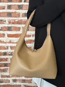 Casual soft leather shoulder bag for women, simple hobo underarm design for daily wear.