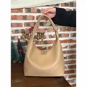Minimalist soft leather shoulder bag for women, casual hobo handbag with stylish design.