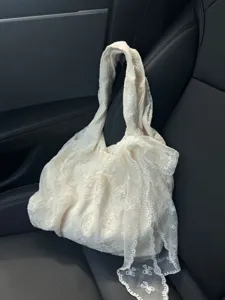 Elegant white lace tote bag with bow detail, stylish casual shoulder bag for women daily commute.
