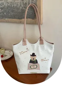 Detail view of the Korean style canvas tote bag featuring a cute cartoon dog graphic and polka dots.