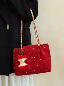 Detailed close-up shot of Korean red floral canvas tote bag with colorful beaded shoulder strap.
