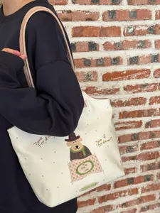 Korean style cartoon puppy tote bag detail view, casual canvas shoulder bag with cute design.
