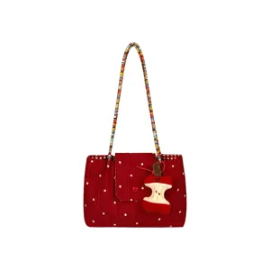 Korean style red plaid canvas shoulder bag with woven strap and cute apple plush pendant.