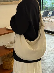 Detail view of the Korean style pleated drawstring cloud bag, large capacity hobo shoulder bag.
