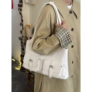 Korean style minimalist white shoulder bag with dual front pockets casual tote bag.