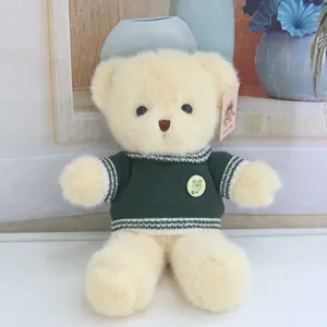 Cute stuffed teddy bear plush toy wearing green sweater soft animal doll for kids birthday gifts
