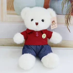 Cute white teddy bear plush toy wearing a red polo shirt and blue jeans, soft doll gift.