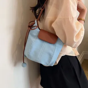Chic denim bucket bag for women, stylish contrast leather crossbody shoulder handbags.