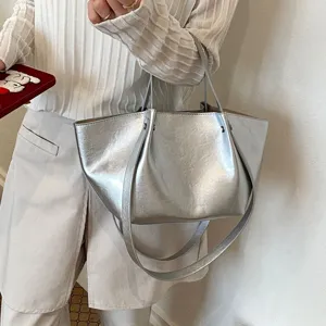 Silver metallic tote bag for women, large capacity minimalist shoulder bag for commute daily use.