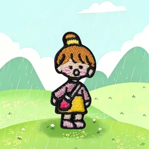 Closeup of cute cartoon character embroidery patch, detailed cloth badge for clothing and bags.