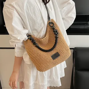 Straw woven shoulder bag for women summer casual large capacity tote handbag with beaded handle.