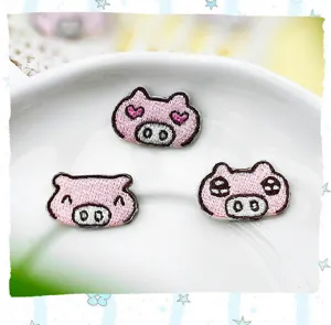 Cute cartoon pig embroidered patches detail showing fine stitching, ideal for DIY clothing repair.