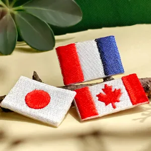 Embroidery flag patches set featuring French, Japanese, and Canadian flags for apparel.