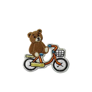 Cute cartoon teddy bear bicycle embroidery patch for DIY clothing and canvas bags decoration.