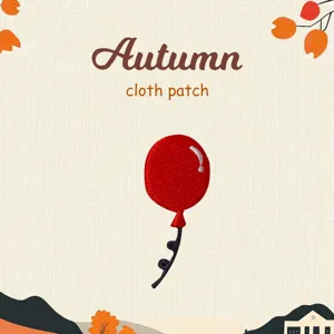 Close up view of a red balloon cloth patch, detailed embroidery texture for DIY autumn style.
