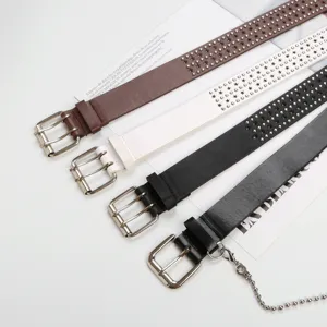 Detailed view of trendy PU leather belts featuring star stud designs, double buckles and a chain.