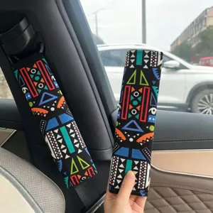 Geometric print car seatbelt shoulder pad, black fabric bohemian style car interior accessory.