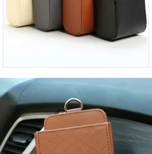 Car air vent storage bag detail showing diamond quilted leather texture and hanging metal ring.