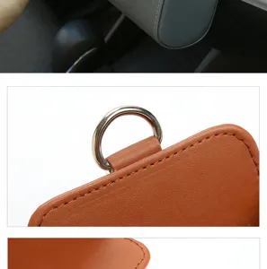 Car leather storage box detail view showing neat stitching and metal ring for interior use.