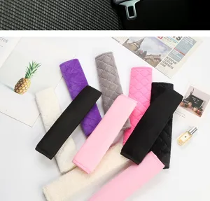 Plush car seat belt shoulder pads, soft quilted protective covers for comfortable driving experience.