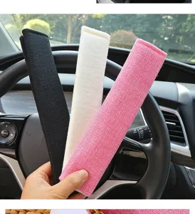 Comfortable linen car seat belt shoulder pads in black, white, and pink for driving comfort.