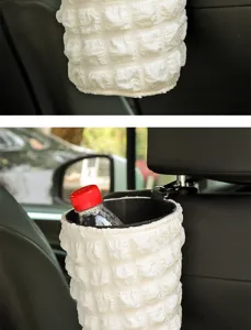 Close-up detail of the white puff hanging car trash can showing texture and interior structure.