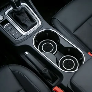 Detailed shot of anti-slip car cup holder coasters with honeycomb pattern in console.