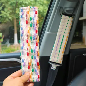 Colorful woven car seatbelt cover, soft fabric shoulder pad protector, cute auto interior decor.