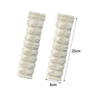 Puffy car seat belt shoulder pads, soft textured cushion strap cover for driving comfort.