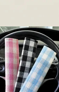 Plaid car seatbelt shoulder pad soft fabric strap cover for comfortable driving experience.