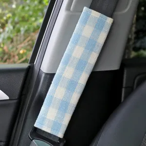 Blue and white plaid car seat belt cover, soft fabric shoulder pad for auto interior.