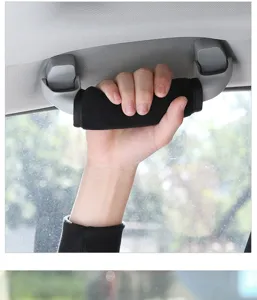 Close-up detail view of the soft black car roof grab handle protective cover in use.