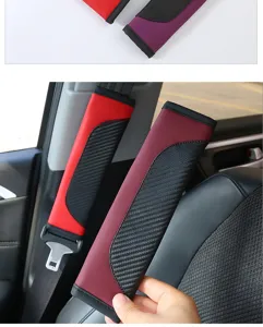 Close-up detail of the carbon fiber pattern leather car seat belt shoulder pad in use.