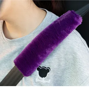 Close-up detail of soft purple plush car seatbelt cover, providing comfortable shoulder pad.