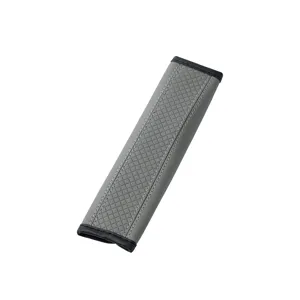 Grey leather car seat belt shoulder pad with diamond quilted pattern for comfortable driving.