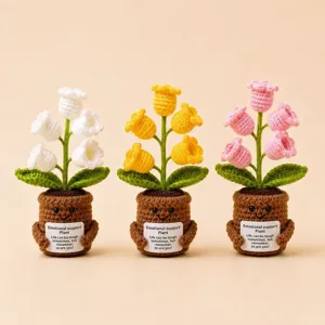 Handmade crochet lily of the valley potted plant with positive message desk decor.